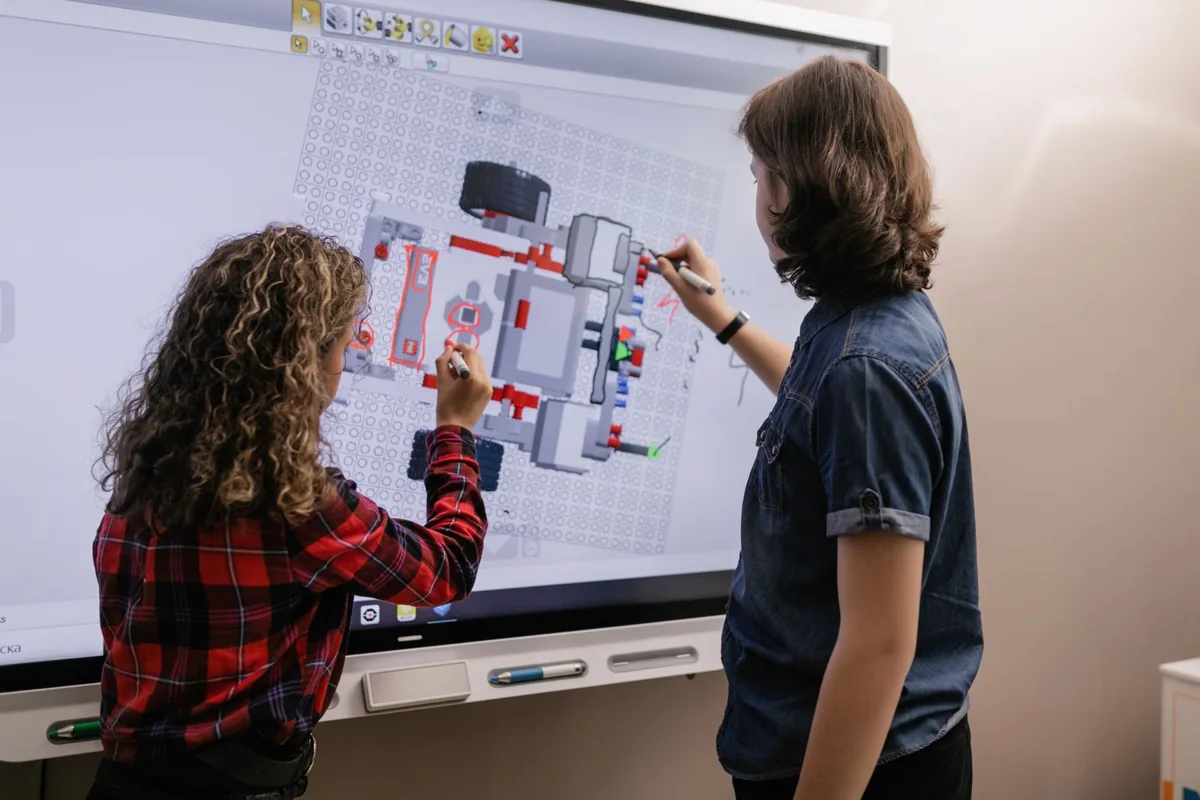Students learning together in a bright classroom