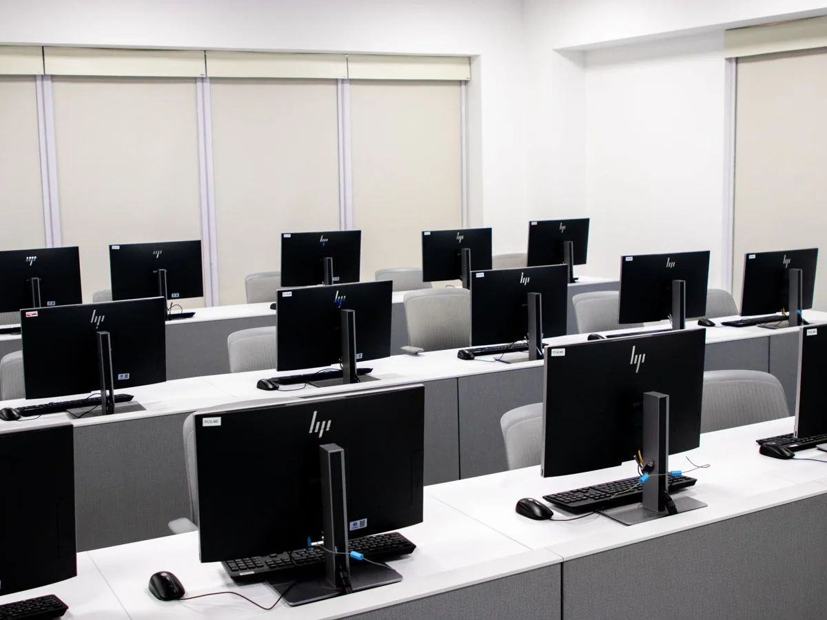 Computer laboratory with rows of desktop workstations
